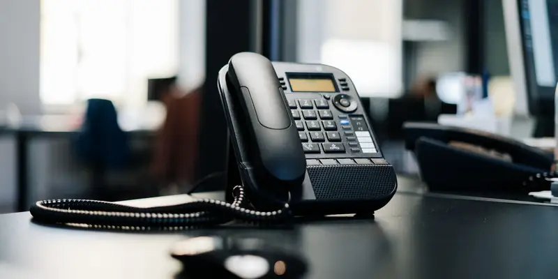 Office desk phone ready to answer business calls