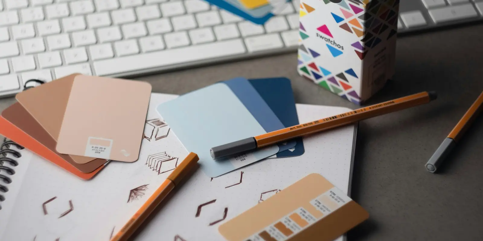 Designer's desk with colour swatches and sketches (Brand Identity)
