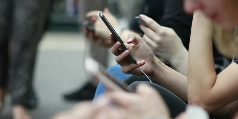 People engaging with an online community on their phones