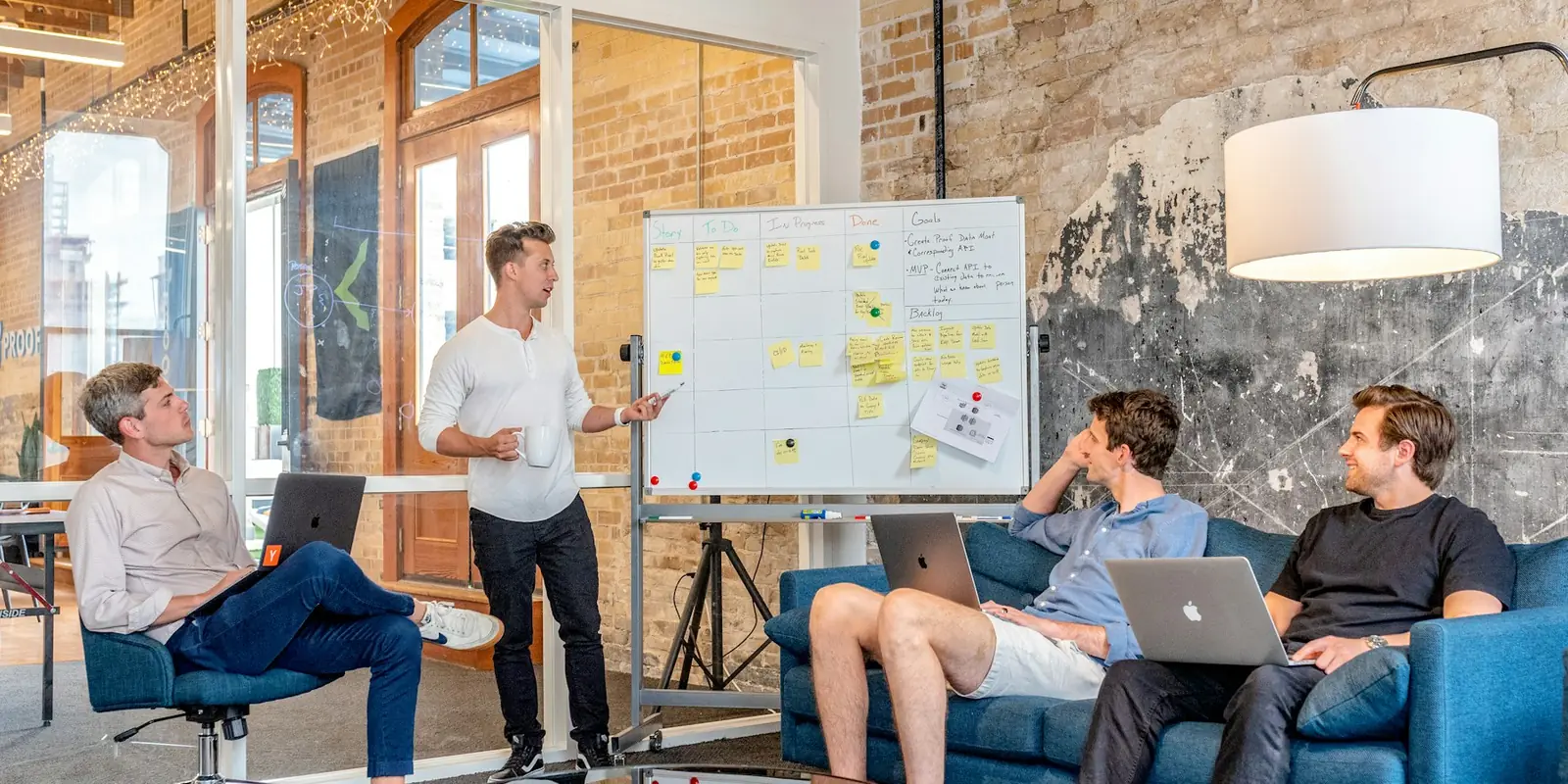 Software team planning a custom solution at a whiteboard, Islamabad