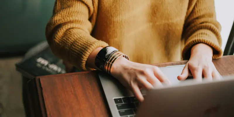Person reading marketing emails on a laptop