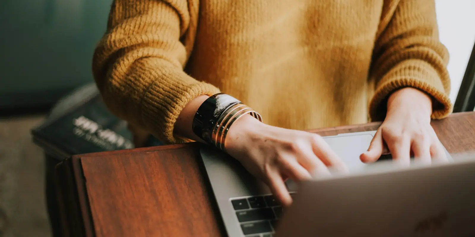Person reading marketing emails on a laptop (Database Reactivation)