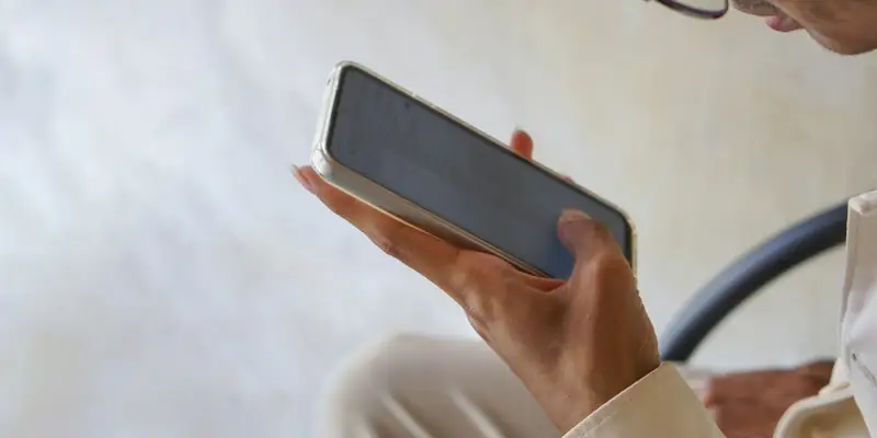 Person scrolling a social media feed on a phone