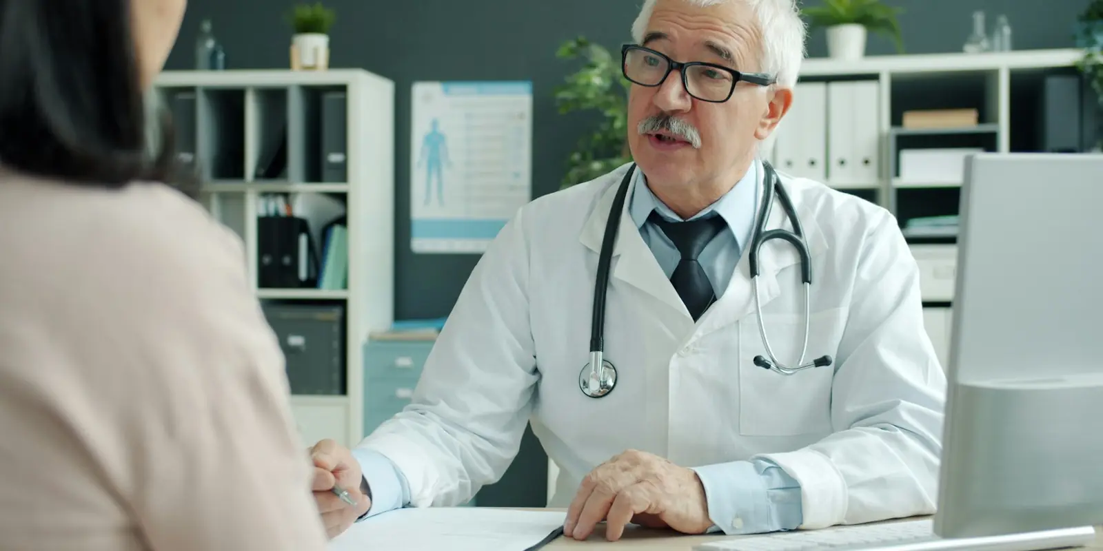 Doctor speaking with a patient in a clinic: AI Calling Agents