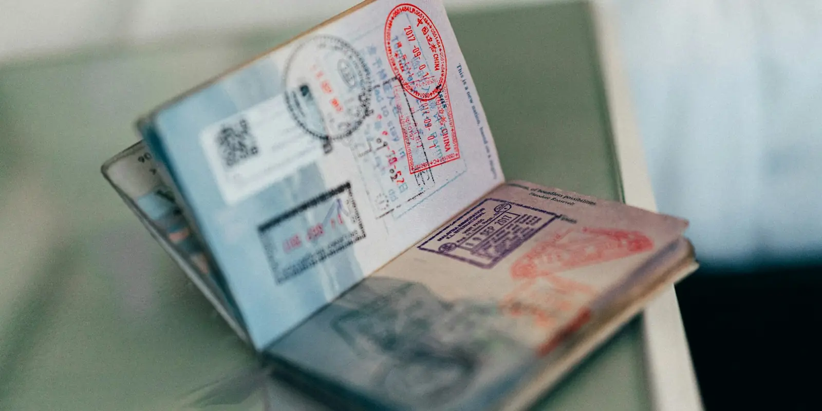 Passport with travel visa stamps