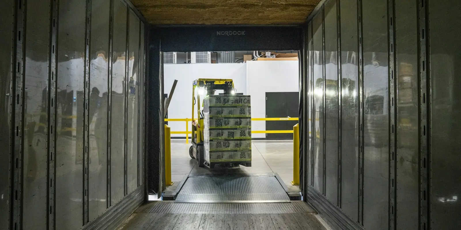 Forklift moving goods in a logistics warehouse, USA