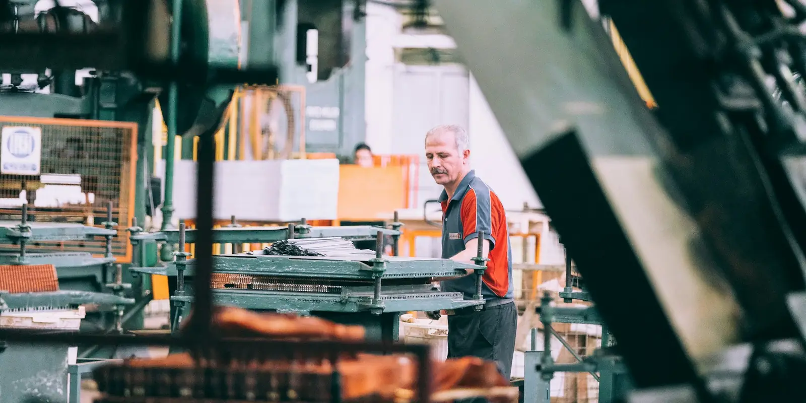 Worker operating machinery in a factory