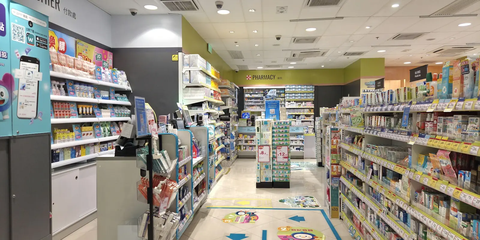 Pharmacy aisles stocked with medicines, UK