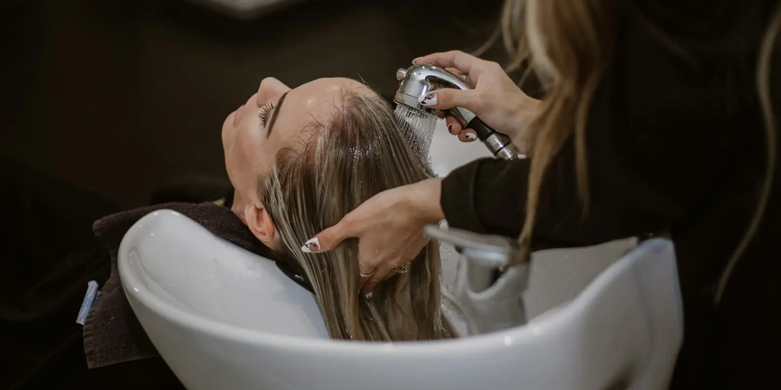 Hair stylist with a client at a salon: Website Design
