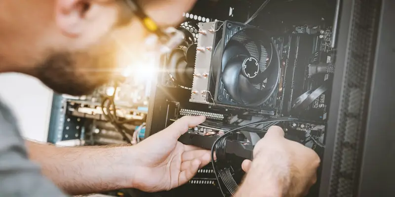 IT technician working inside a computer