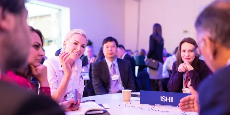 Business professionals networking at a conference