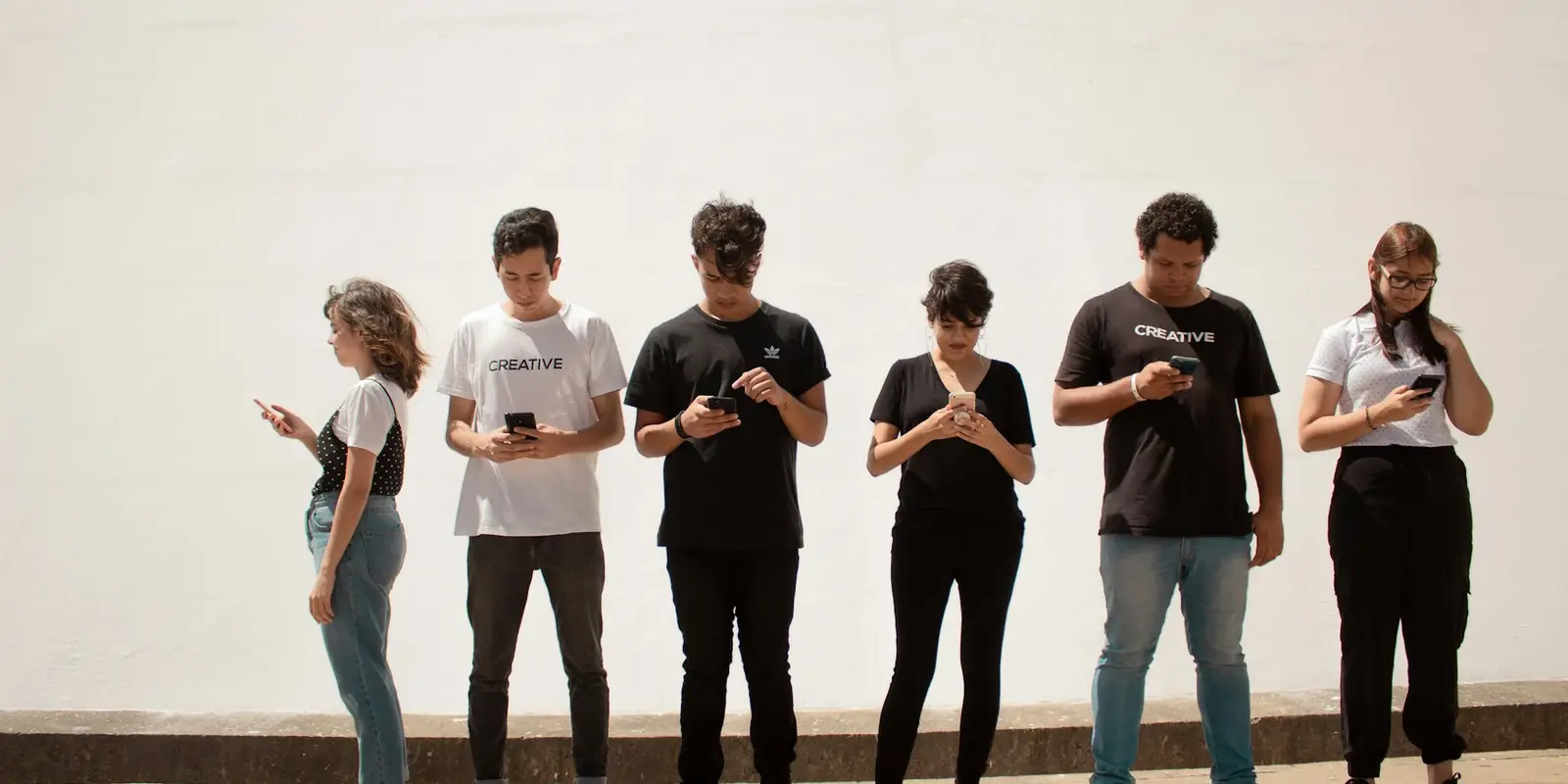 Group of people using social media on their phones (Digital Marketing)