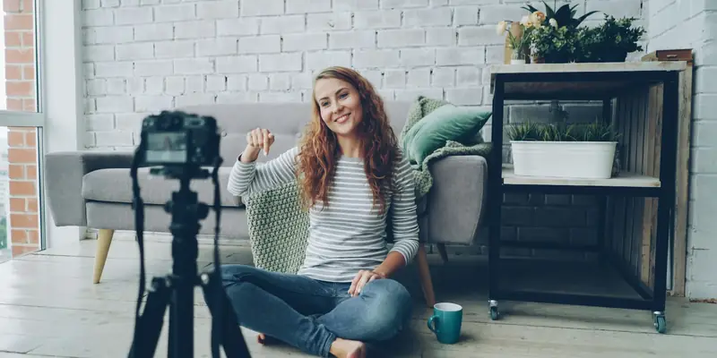 Woman recording a short video at home