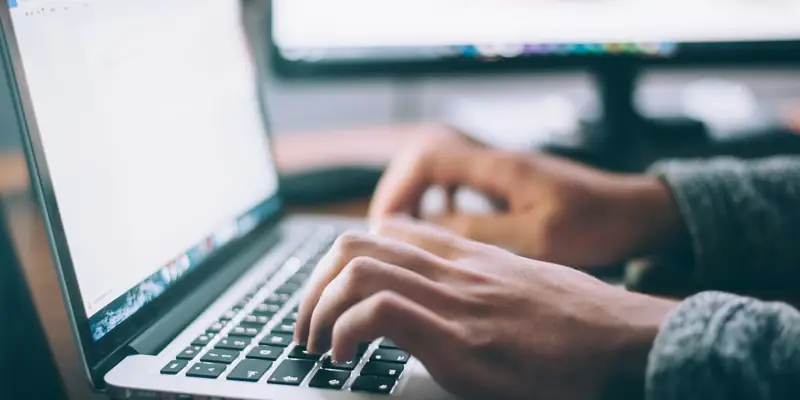 Developer building a website on a laptop